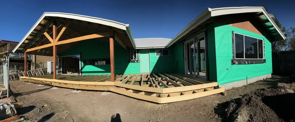 Wraparound deck framing on a Gold Coast home, joists laid and ready for boards