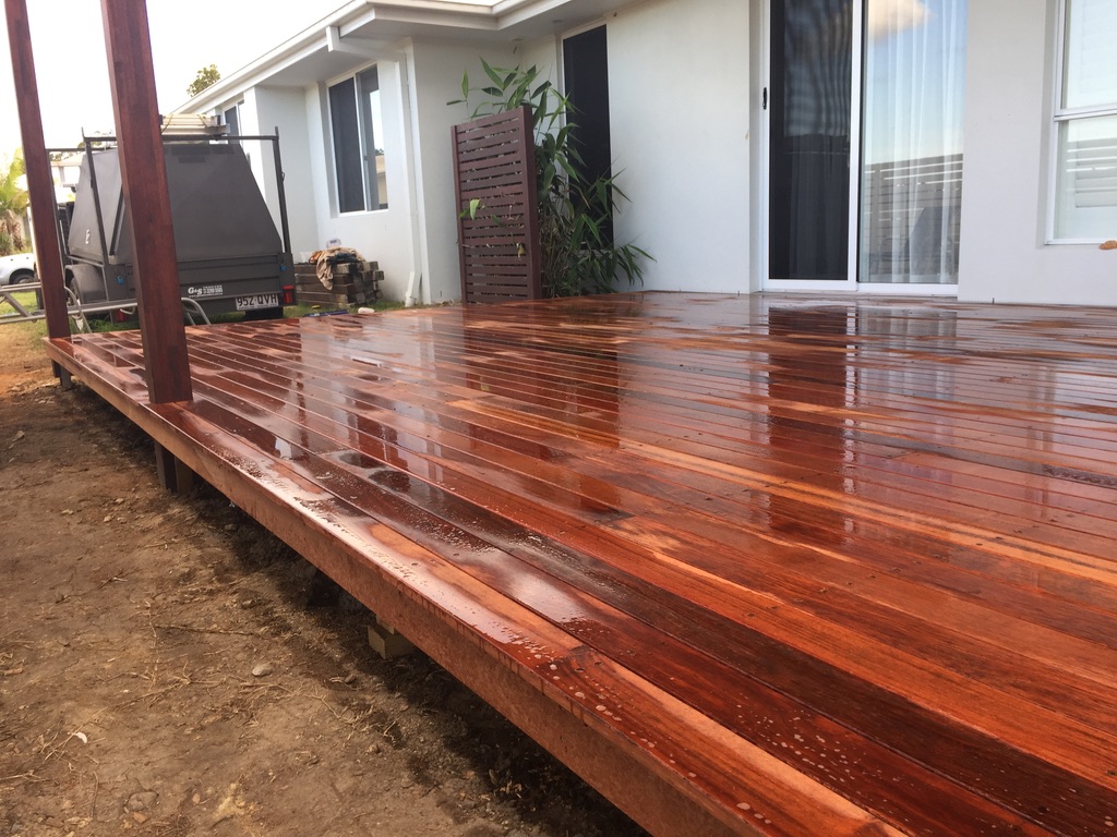 Freshly oiled Merbau deck beside a modern Gold Coast home